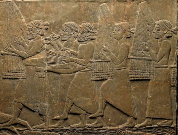 The “Elamite orchestra” from a relief in the palace of Assurbanipal at Nineveh. Seventh century BCE. British Museum 124802,c. British Museum 124802,c. ©The Trustees of the British Museum. CC By-NC-SA 4.0