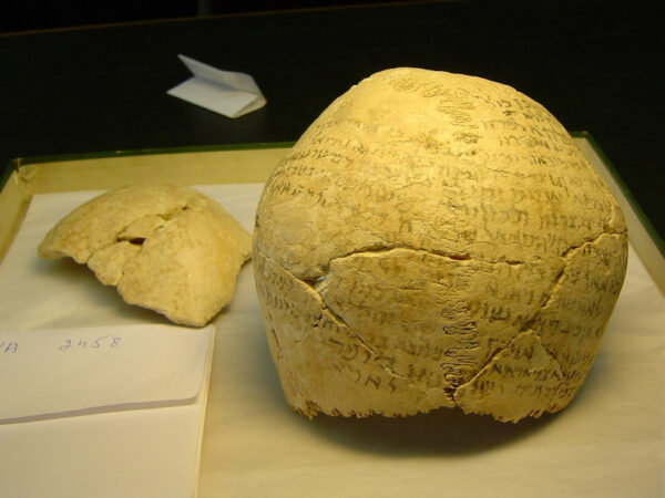 Parts of two magic skulls covered with spells from Mesopotamia, probably Fifth to seventh century. Vorderasiatisches Museum, item VA 2458. Photograph by Yuval Harari.