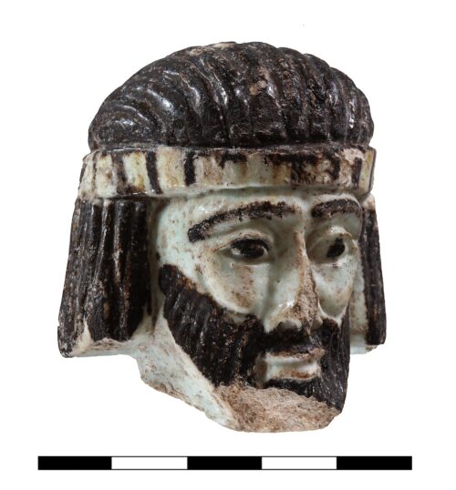 Faience head from Area B. Photo by Gabi Laron