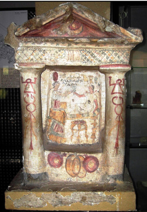 Lilybaeum (Marsala). Punic funerary stelae illustrating a scene of banquet and decorated on the basis with pomegranates and a quince (2nd century BCE).