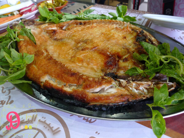 Masgouf is considered a national dish of Iraq. Tigris River carp is butterflied, heavily salted, and slow-grilled over an open flame and seasoned with spices. Photo by Hill93, CC By-SA 4.0 via Wikimedia.