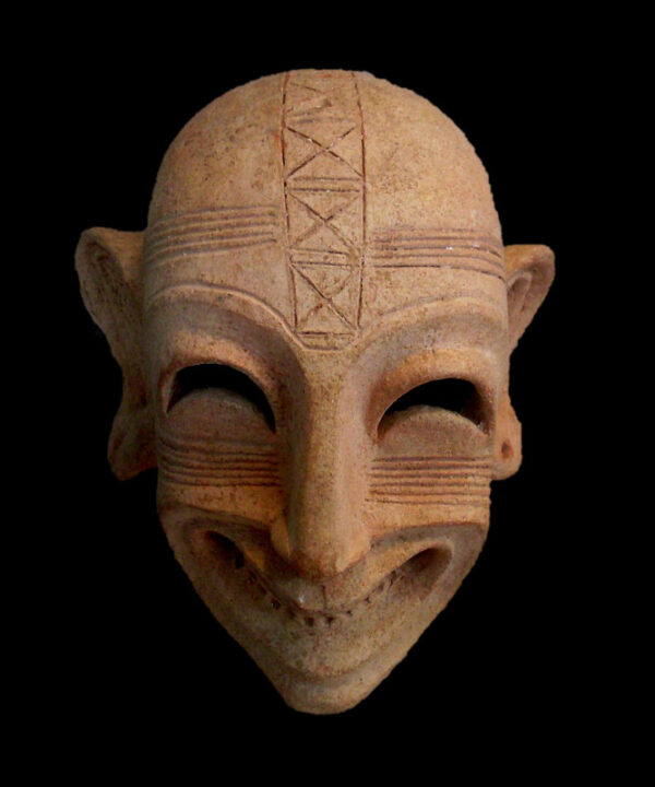 Carthage, necropolis: grinning mask, c. mid-6th – first quarter of the 5th century BC. (Wikimedia Commons).