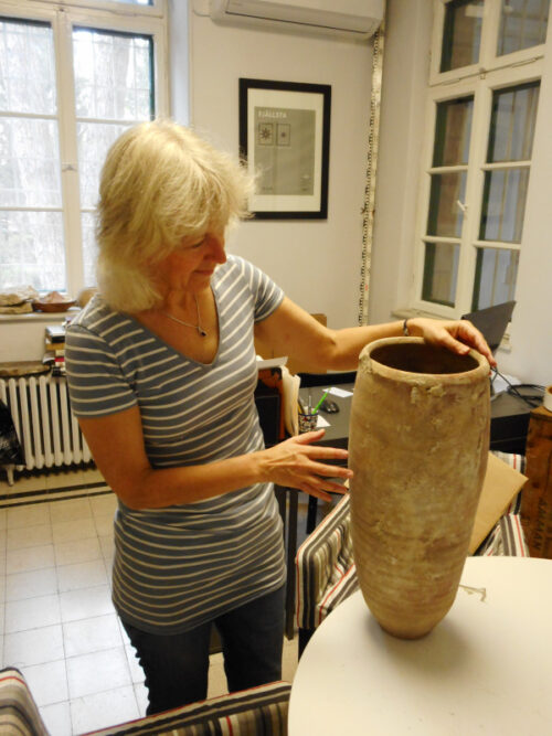 Joan Taylor inspects the vessel. Image courtesy of Joan Taylor.