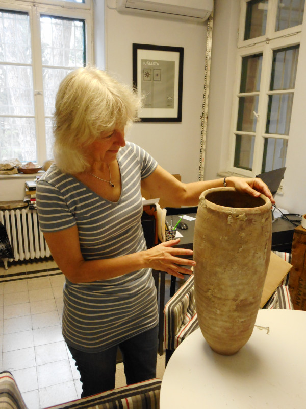 Joan Taylor inspects the vessel. Image courtesy of Joan Taylor.