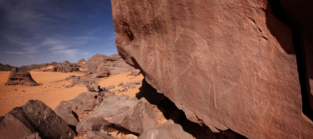 Running giraffes on a sandstone cliff: the link between art and landscape is a constant of Saharan rock art (Rahrmellen, Tadrart Acacus. Photo courtesy FIlipp Gallino; © Sapienza University of Rome).