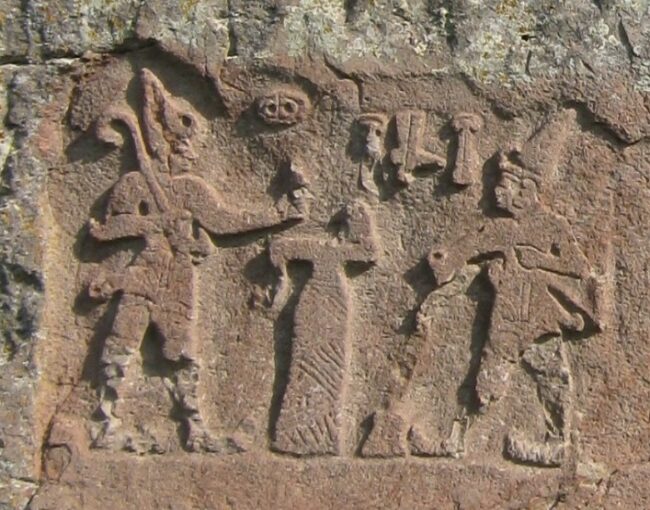 Hattusili III (right) pours a libation before a deity (left), Firaktin relief, Turkey. Photo by Krähenstein, CC by-SA 3.0.