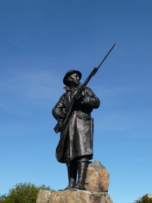 Minto War Memorial, (Scotland), dedicated 1925. The face is based on Desmond Elliot, son of the Earl of Minto. Photo by the author.