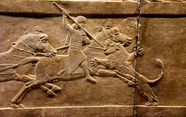 Detail of Ashurbanipal on his horse in the lion's hunt scene at the British Museum. Photo by Osama Shukir Muhammed Amin FRCP(Glasg) via Wikimedia. CC By-SA 4.0.