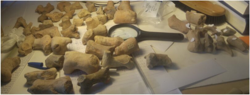 Looking for fingerprints on Hama zoomorphic figurines. Photo by A. Sanders.