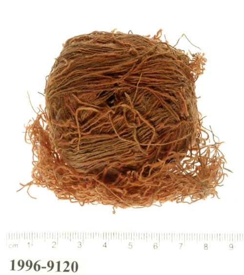 Skein of wool made by double dyeing with Madder and Weld to imitate the 'tola'at shani’ (Photo by Clara Amit, Courtesy of the Israel Antiquities Authority)