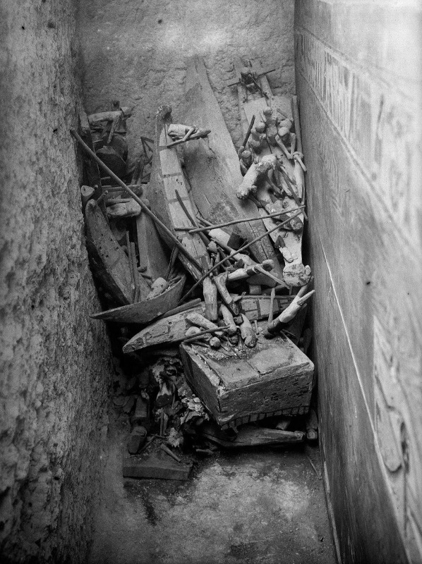 Figurines in a ransacked tomb chamber next to the coffin (right). Tomb of Djehutynakht (Barsha), Dynasty 12. Museum of Fine Arts, Boston (1915).