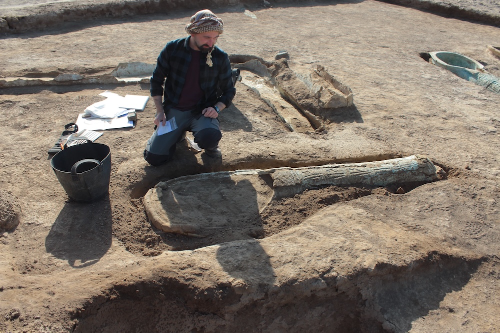 Excavation of coffins from the burial ground. Courtesy of Jörg W.E. Fassbinder.