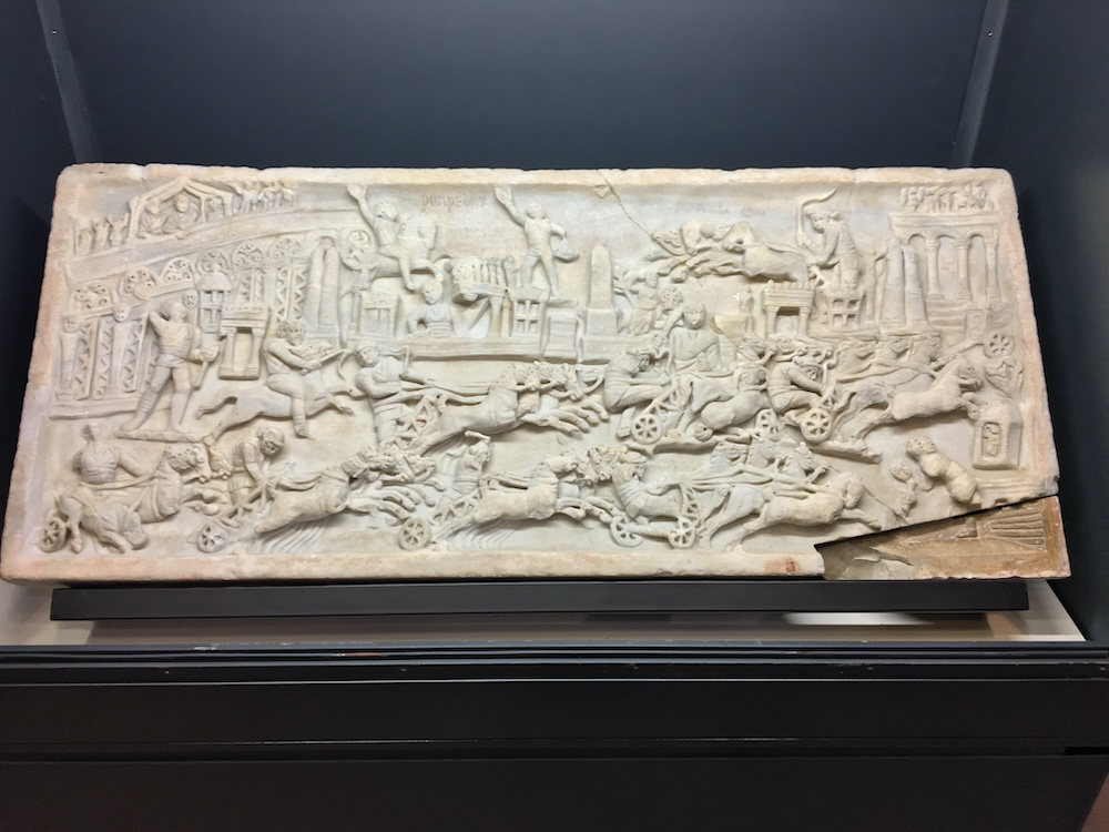 Relief (funerary?) with scene of the circus races. Late third (?) century C.E. Marble. H. 55 cm. x L. 1.30 m. Foligno, Palazzo Trinci, Museo Archeologico. Image: author; reproduced with permission of the Comune di Foligno.