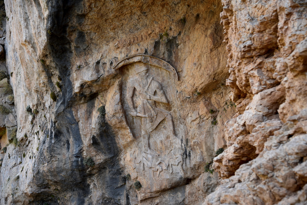 The rock-relief at Darband-i Gawr (pass of the pagan), Mt. Qaradagh, Sulaymaniyah, Iraq. 2250-2100 BCE. The victorious figure trampling over his defeated enemies (probably Lullubi) is unidentified, as there is no cuneiform inscription on or beside the relief. It is unknown whether this figure represents Naram-Sin of Akkad, an Ur III ruler, or a local ruler; Anubanini is a lesser likelihood. Photo courtesy of the author.
