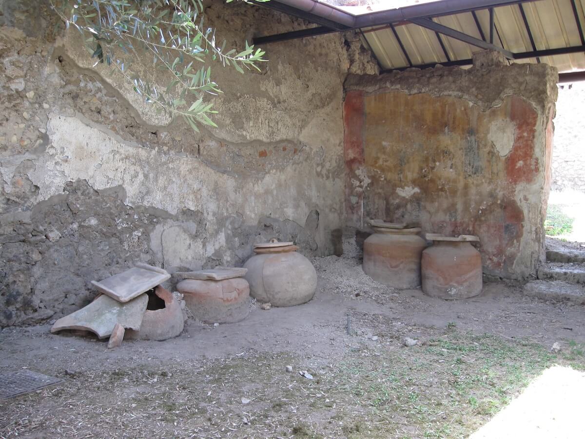 Garum Shop, Pompeii with ceramic jars containing fish sauce. Courtesy of the Soprintendenza Archeologica di Pompei.