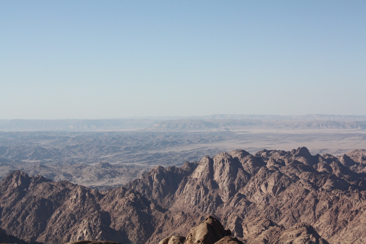 El-Tih Plateau in central Sinai in the horizon (above 1,000m ASL) from the High Mountains of Sinai Peninsula (above 2,000m ASL), where the upland hills separate both regions (Taken 13 August 2015 by Sinai Peninsula Research Project).