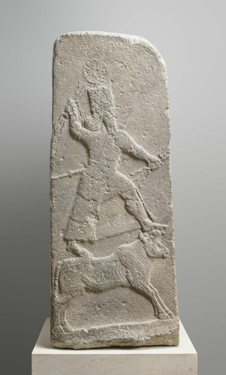 Stele representing the storm god Adad brandishing lightning-bolts. Reign of Tiglath-pileser III (744-727 BC). © 2018 Musée du Louvre, Dist. GrandPalaisRmn / Mathieu Rabeau.