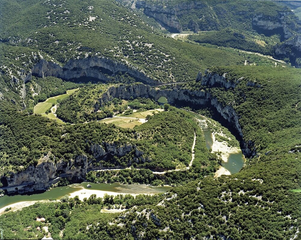 Aerial view showing the region of the Chauvet-Pont d’Arc cave. Photo by Équipe Chauvet – Ministère de la Culture et de la Communication.