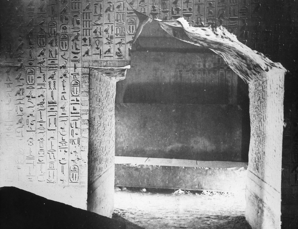 A view into the burial chamber of King Unas at Saqqara, the walls of which are inscribed with ritual incantations known as the Pyramid Texts. Photo taken in 1900. Courtesy Brooklyn Museum Archives.