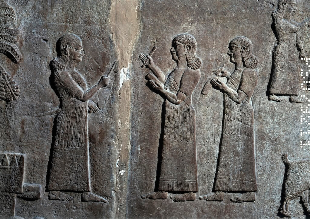 Assyrian and Aramaic scribes on Neo-Assyrian bas-reliefs. © The Trustees of the British Museum