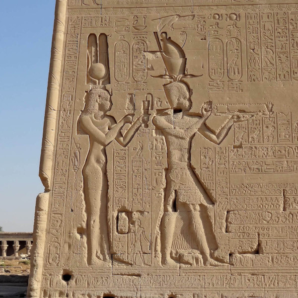 Cleopatra dressed as Hathor with her son Caesarion pay homage to the gods. Relief on the temple at Dendera, Egypt (Photo: Olaf Tausch via Wikimedia Commons, CC BY 3.0 DEED. Photo has been cropped)