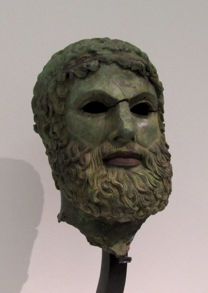 Fig. 7: Bronze statue head of a bearded youth from the Porticello shipwreck. Currently in the National Archaeological Museum of Reggio Calabria, Italy. ©Katerina Velentza.