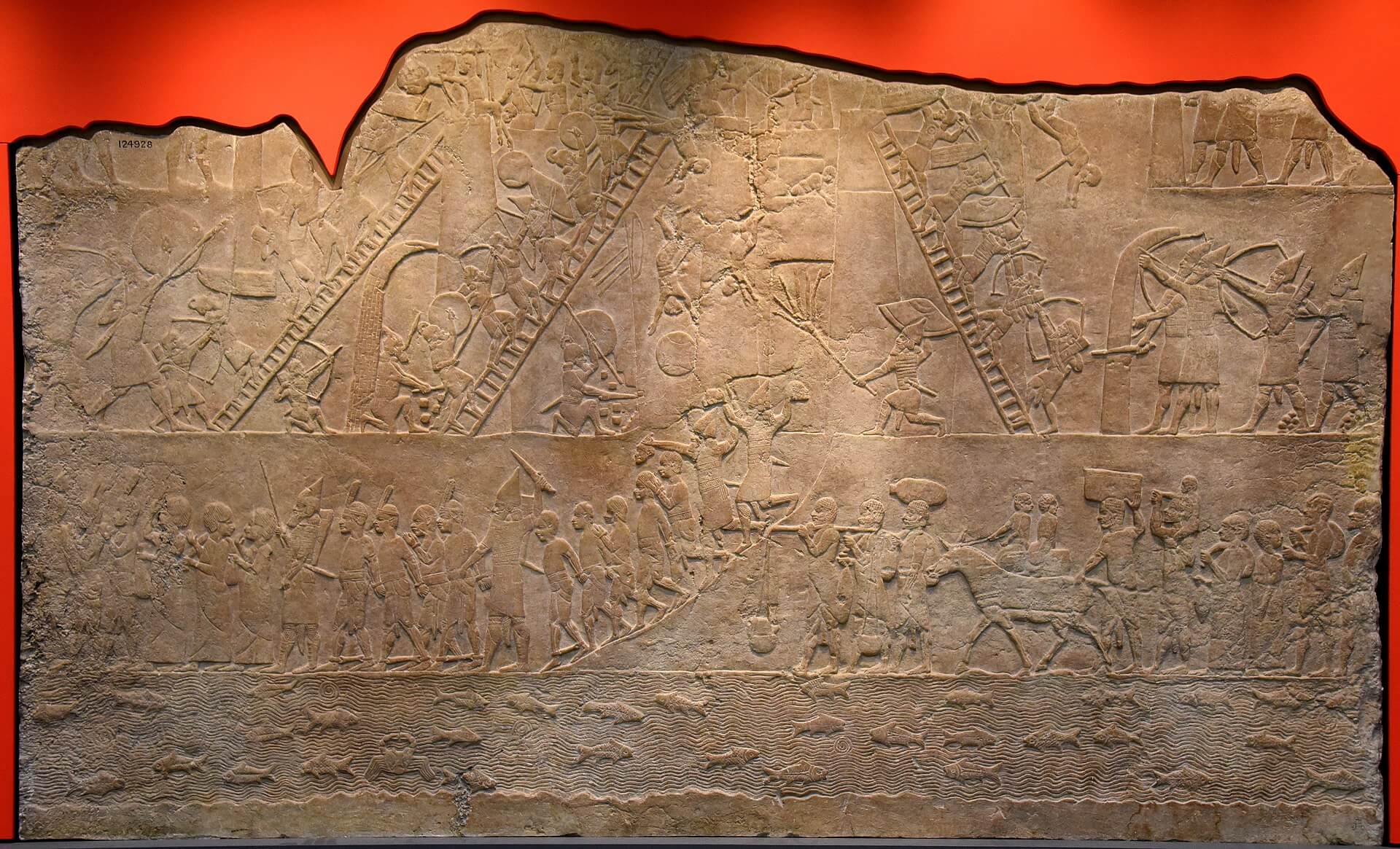 Wall panel from the palace of Ashurbanipal in Niniveh showing the Assyrian army storming a fortress in Egypt, British Museum 124928 (Wikimedia Commons / Osama Shukir Muhammed Amin).