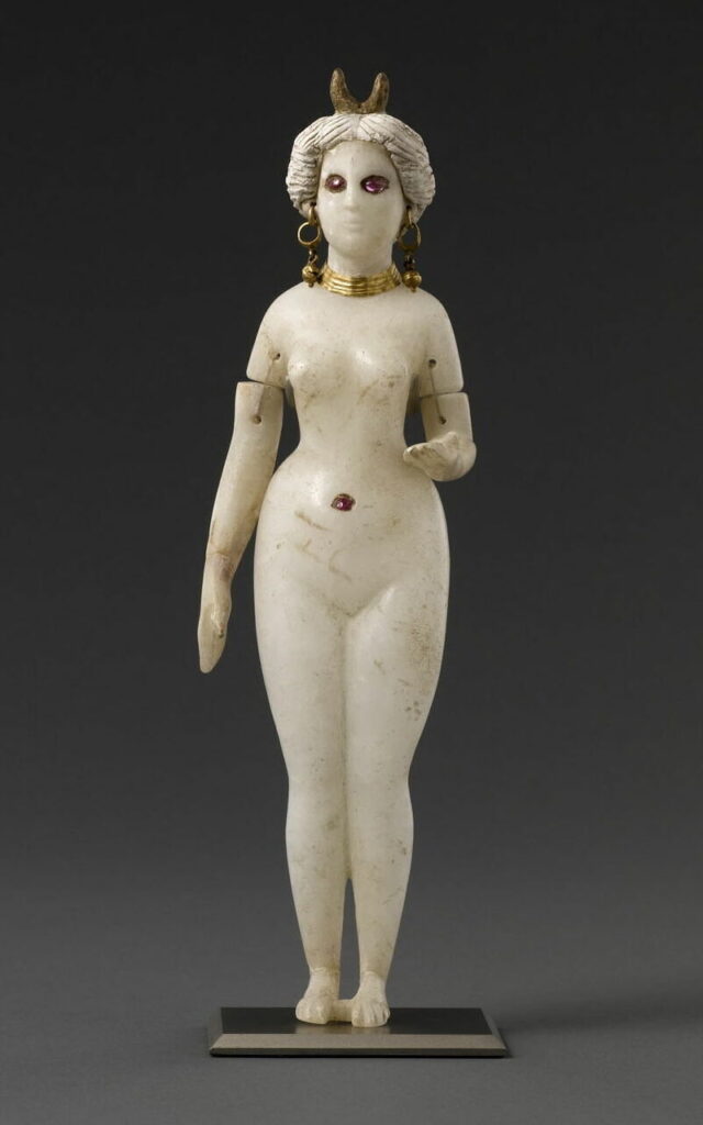 Figure 1. Nude standing female figurine, likely the goddess Ishtar-Aphrodite, with crescent crown and jointed arms (separately made and attached). From Tomb 4 at Hillah, near Babylon (Iraq). Alabaster with gold, rubies, plaster, and bitumen, c. 2nd century BCE-1st century CE. Ht 25cm. Louvre AO 20127. Photo: © 2011 RMN-Grand Palais (musée du Louvre) / Franck Raux