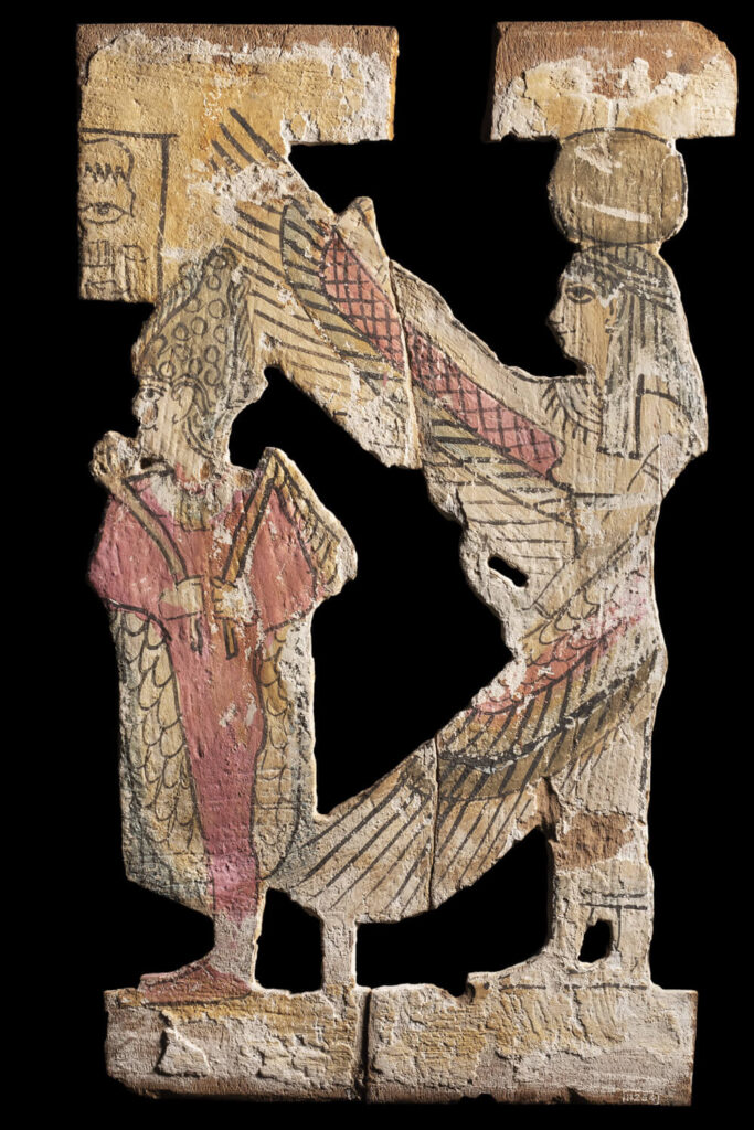 Carving from probably a coffin or funerary bier of Osiris and Isis, Roman Period, no. 11254. © Manchester Museum.