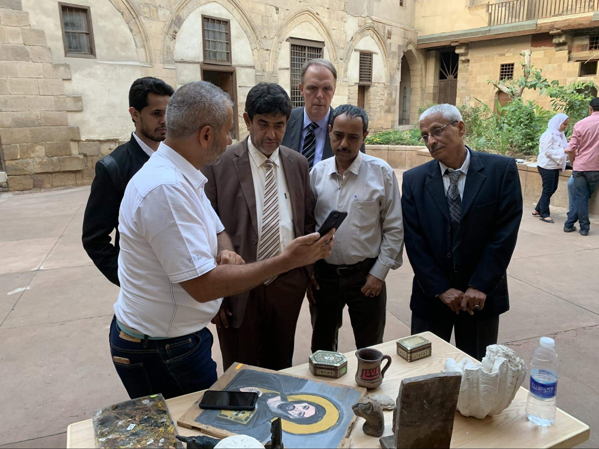 An Egyptian Heritage Rescue Foundation trainer leads a photography training session with Yemeni partners from the National Museum of Aden at the EHRF facility in Cairo. Photo © Peter Herdrich.