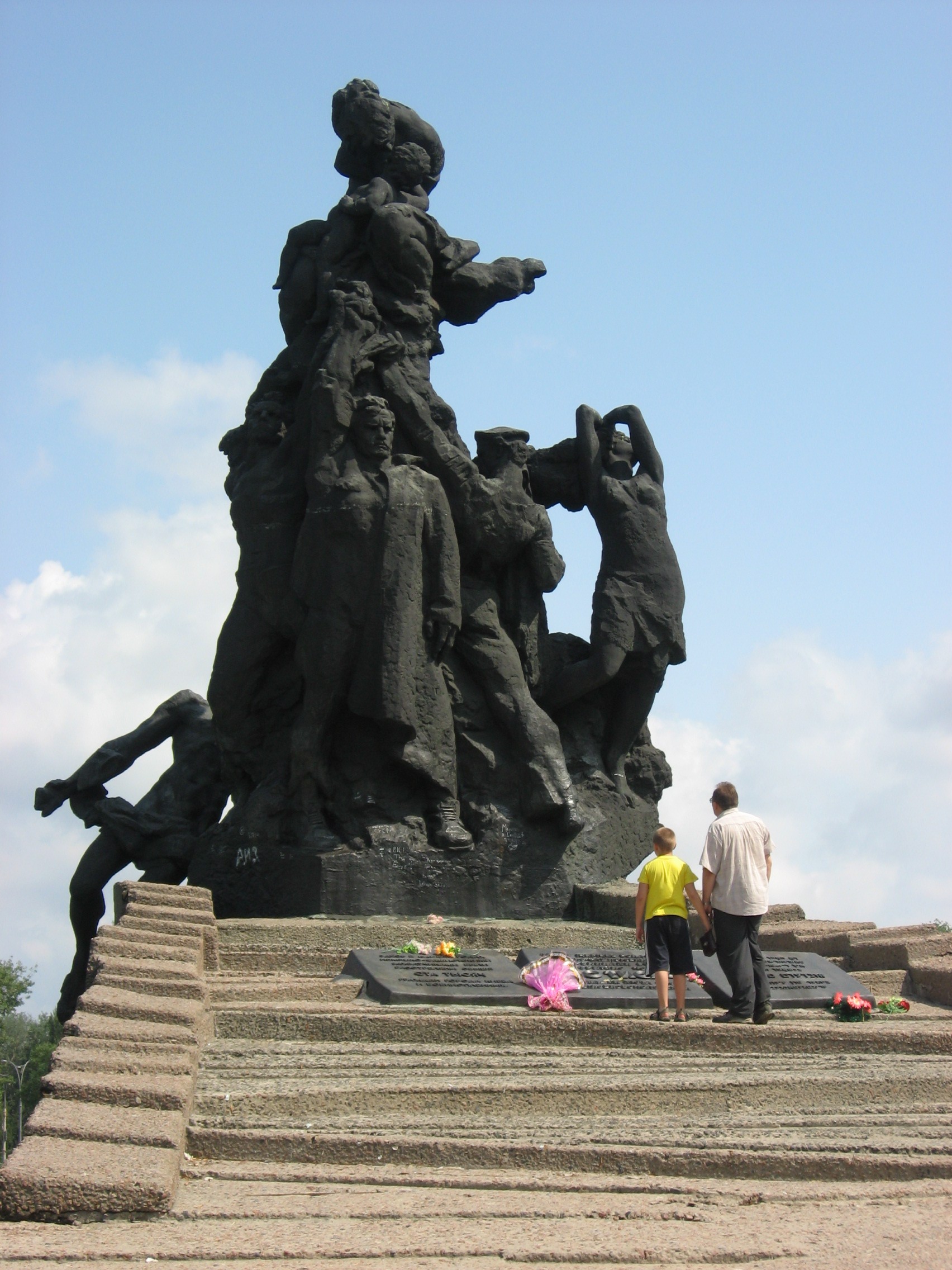 Babyn Yar Holocaust memorial in Kiev. Part of the memorial was struck by a missile fired at a nearby radio tower. Photo by Віктор Полянко via Wikimedia Commons. CC BY-SA 4.0