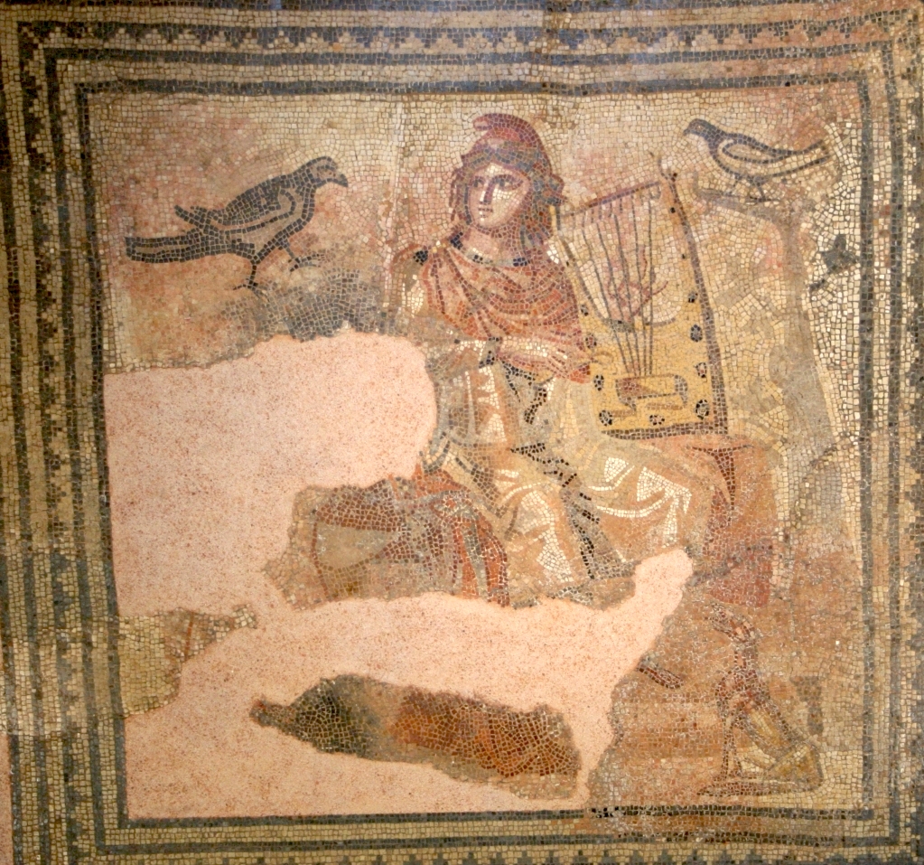 Ravens and crows are also popular motives in Roman mosaics and wall-paintings. In this mosaic from the Dominicans Museum in Rottweil, Germany, dated to the end of the 2nd century AD, a raven is sitting to the left of the famous singer Orpheus. Public Domain via Wikimedia