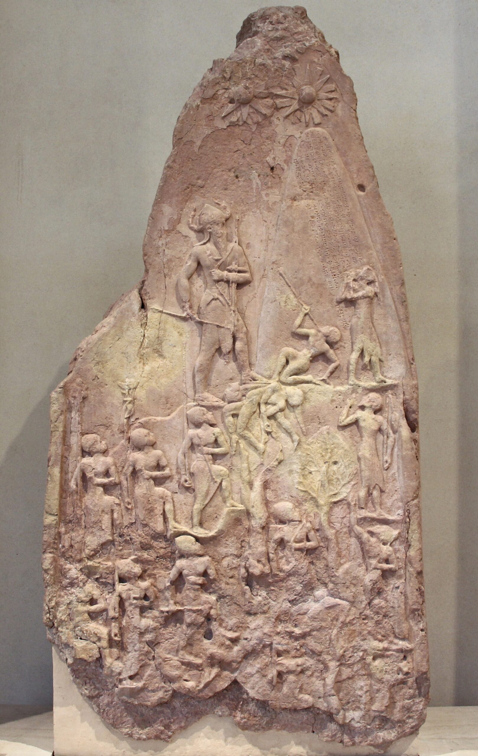 Stele commemorating a defeat of mountain tribes by Naram-Sin, the king of the Akkadian Empire in 2254-2218 BC. © F. Romero, France–Paris–Musée du Louvre, published under CC BY 2.0, via Wikimedia Commons