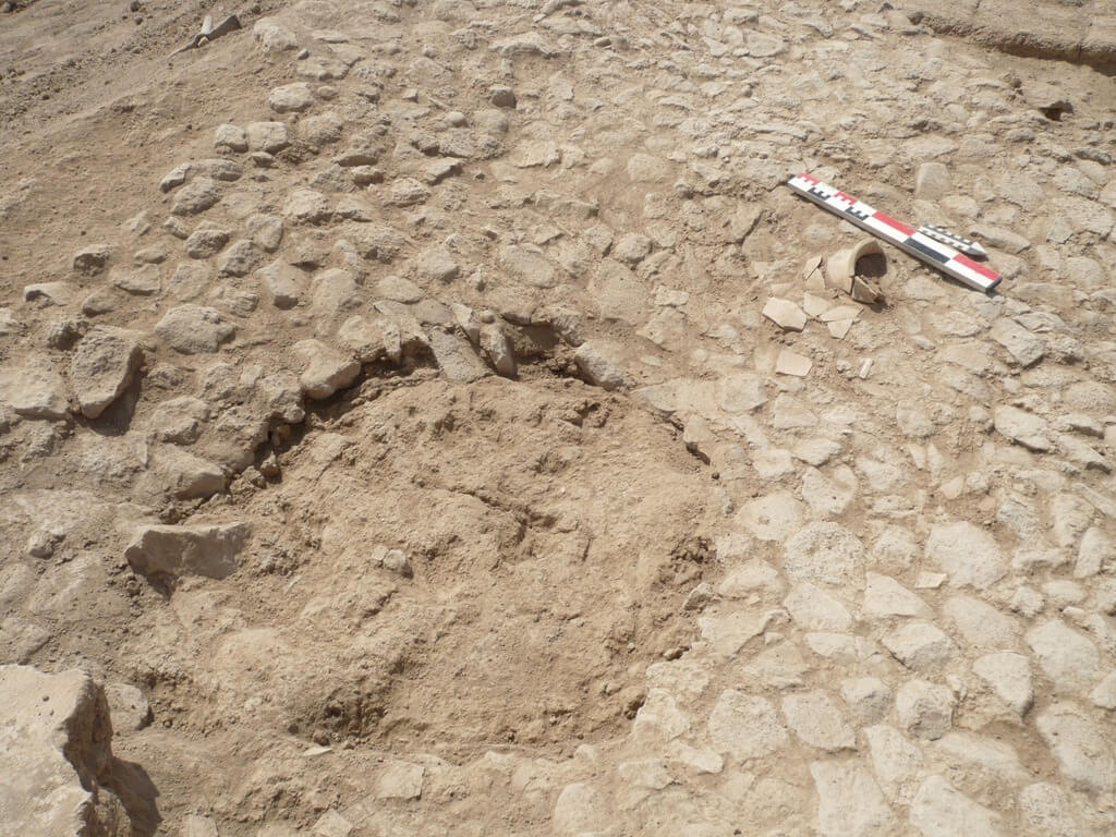 Pit with missing stone floor.