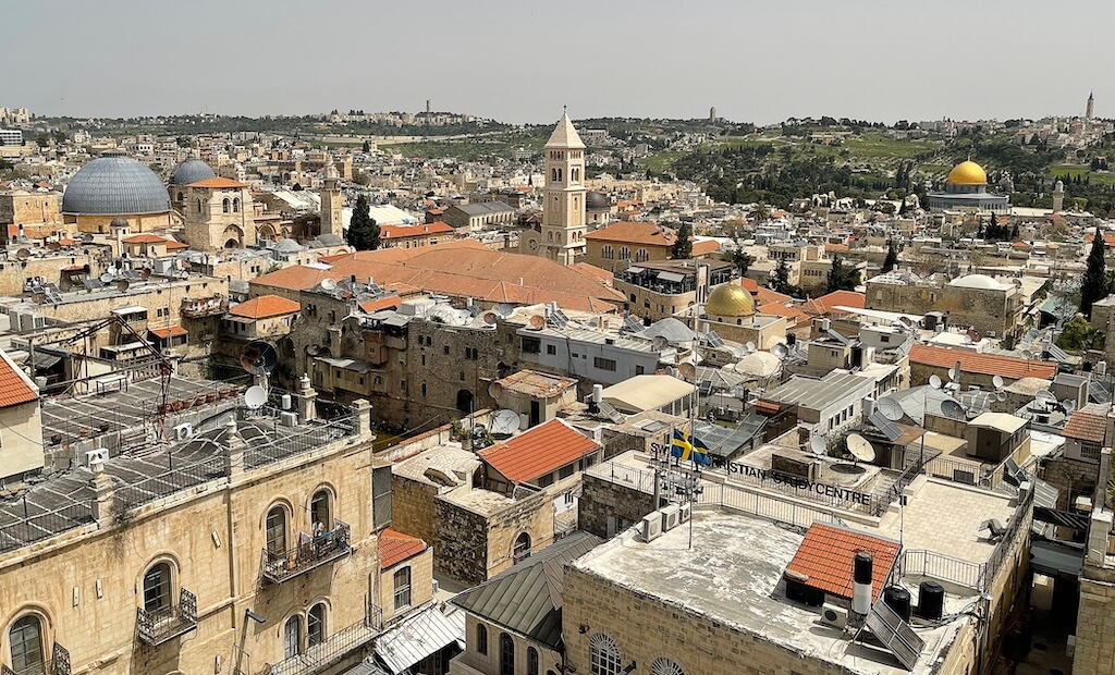 View of the Old City of Jerusalem, looking northeast: The Church of the Holy Sepulcher is on the left (the grey dome); the tower in the middle is the Lutheran Church of the Redeemer; the Dome of the Rock is visible on the right (the gold dome). Photo by Jodi Magness.