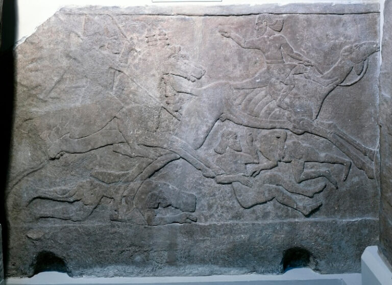 Wall relief depicting Assyrian cavlarymen charging an Arab fighter on a camel. From the Central Palace at Nimrud, reign of Tiglath-Pileser III, ca. 728 BCE. © The Trustees of the British Museum, CC BY-NC-SA 4.0.