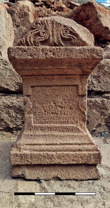 Altar dedicated to Pan-Zeus, found in a secondary use inside a Byzantine wall. (Photo by O. Shinʻar).