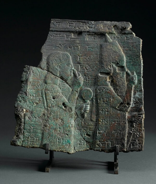 Esarhaddon’s mother Naqia appears on a fragment of a bronze bowl alongside her husband Sennacherib. Louvre AO 20185. © 2005 GrandPalaisRmn (musée du Louvre) / Franck Raux