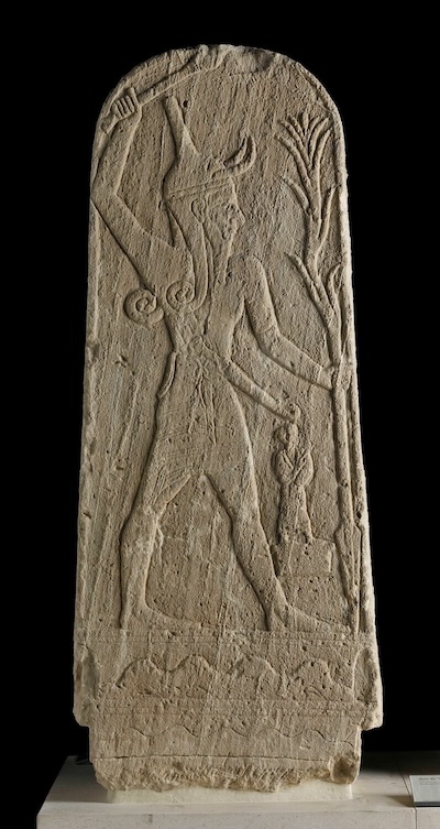 Stele of Baal brandishing a club and holding a thunderbolt, standing on a pedestal bearing images of mountains and the sea in relief. From the Temple of Baal, Ugarit, Late Bronze Age. Louvre AO 15775. Photo © 2006 GrandPalaisRmn (musée du Louvre) / Franck Raux. 