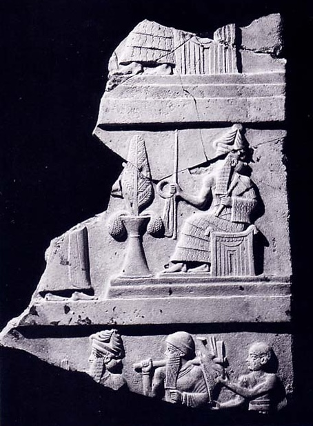 Ur-Nammu stela, showing the king in the lower (broken) register carrying tools used in mudbrick construction. Object B16676.14. Courtesy of the Penn Museum.