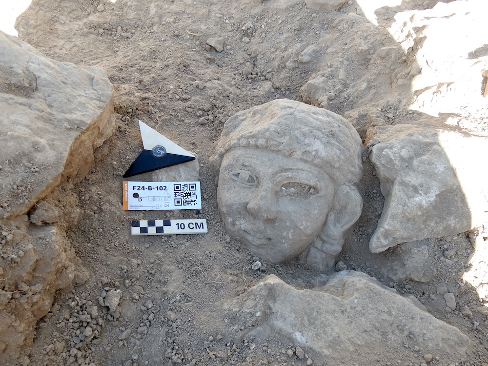 Female stone sculpture of the “Double-face female head” type in situ during the 2024 campaign. ©Amman Archaeological Project (Münster University, DAI, Felix Wolter)