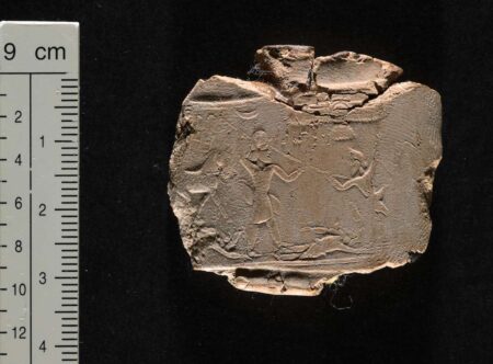 Bulla bearing Aršāma’s seal, ca. 427-407 BCE. The image depicts the ancestor of the Aršāma line spearing an enemy, with a lion trampling a vanquished fighter behind him. The inscription is partially visible in the upper left hand corner. Bodleian Library Sigill. Aram. V. ©Bodleian Libraries, University of Oxford. CC By-NC 4.0