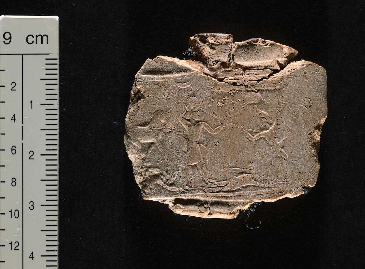 Bulla bearing Aršāma’s seal, ca. 427-407 BCE. The image depicts the ancestor of the Aršāma line spearing an enemy, with a lion trampling a vanquished fighter behind him. The inscription is partially visible in the upper left hand corner. Bodleian Library Sigill. Aram. V. ©Bodleian Libraries, University of Oxford. CC By-NC 4.0