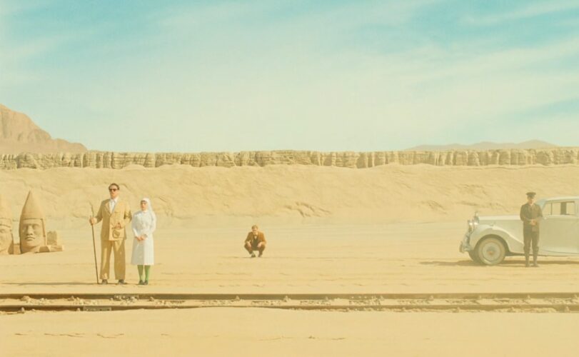 Korda (Benicio del Toro) with his daughter Liesel (Mia Threapleton), waiting for Prince Farouk in the empty landscape of “Lower Western Independent Phoenicia”. The monumental head seems to copy those found at Nemrut Dağ in modern Türkiye. Still image from The Phoenician Scheme (2025), directed by Wes Anderson. Courtesy of Focus Features.